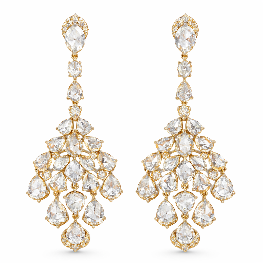 Yellow gold diamond chandelier earrings featuring pear- and marquise-cut diamonds in a cascading high-jewelry silhouette.
