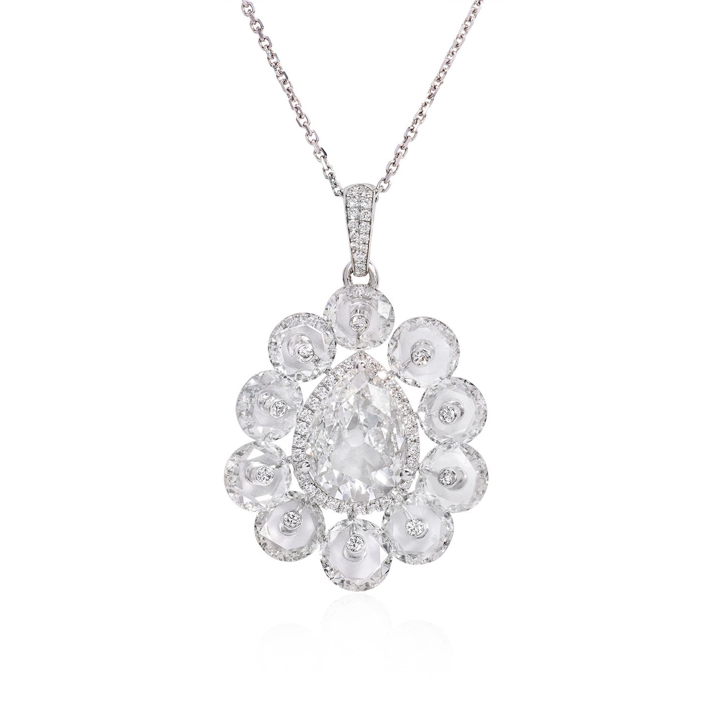 Aurelia diamond pendant featuring a pear-cut diamond surrounded by rose-cut diamonds in 18k gold.