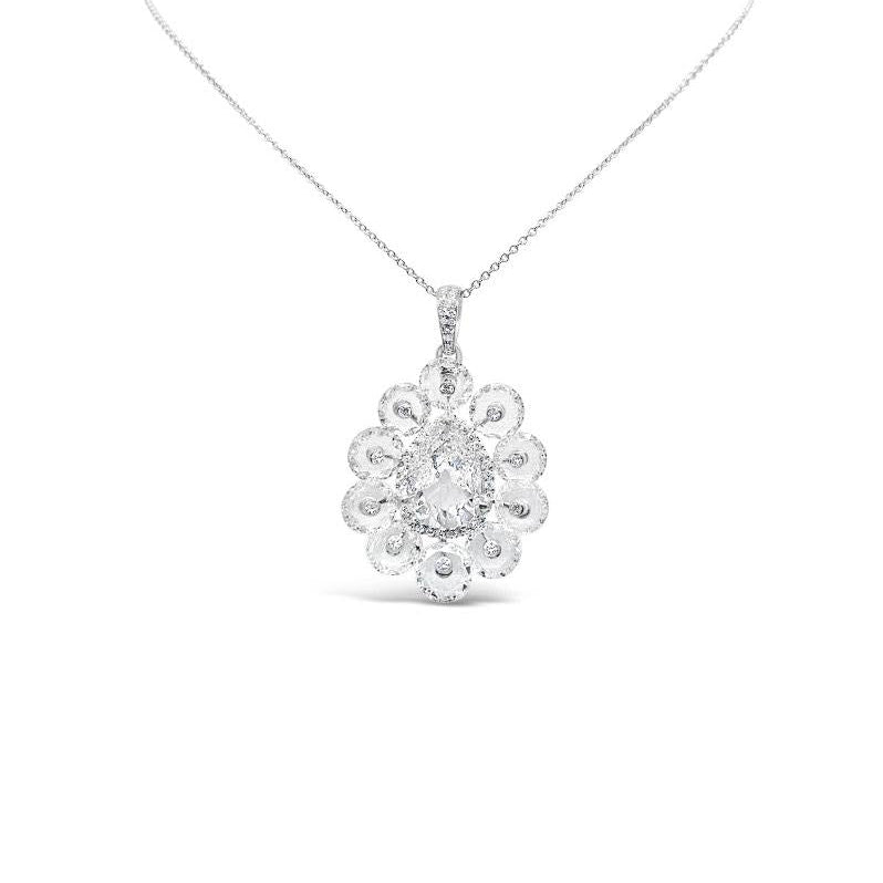 Aurelia diamond pendant featuring a pear-cut diamond surrounded by rose-cut diamonds in 18k gold. 