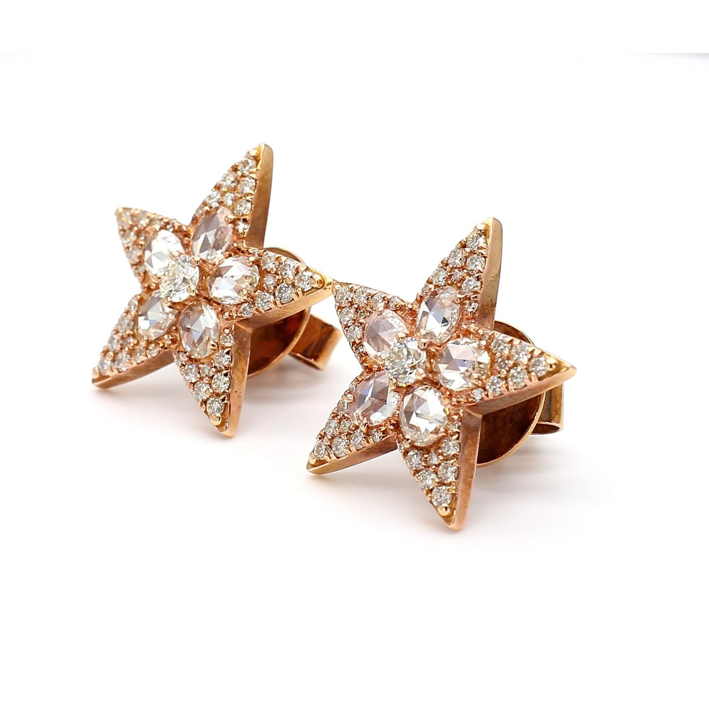 Aurelia star-shaped stud earrings featuring round and rose-cut diamonds in 18k rose gold side profile view.