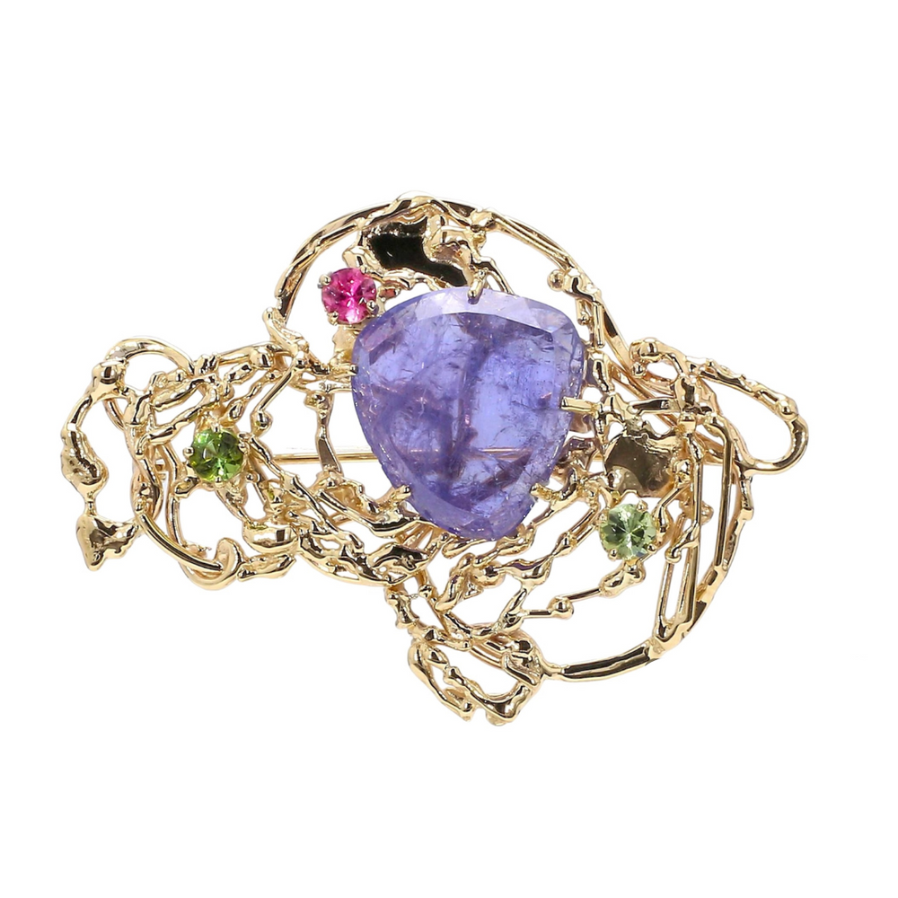 Laurenti bespoke tanzanite brooch featuring pink and green gemstones in an 18K yellow gold sculptural design.