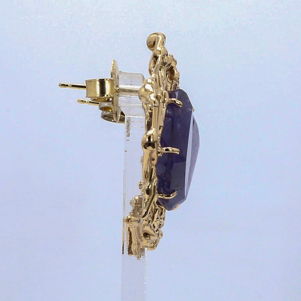 
                  
                    Laurenti bespoke tanzanite sculptural earrings set in hand-sculpted 18K yellow gold.
                  
                