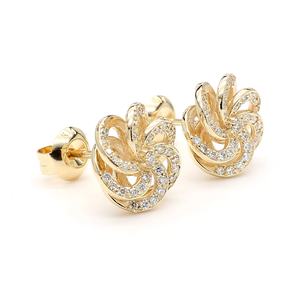 
                  
                    Camellia-inspired diamond stud earrings in 14k yellow gold with round brilliant diamonds, designed by Laurenti New York.
                  
                