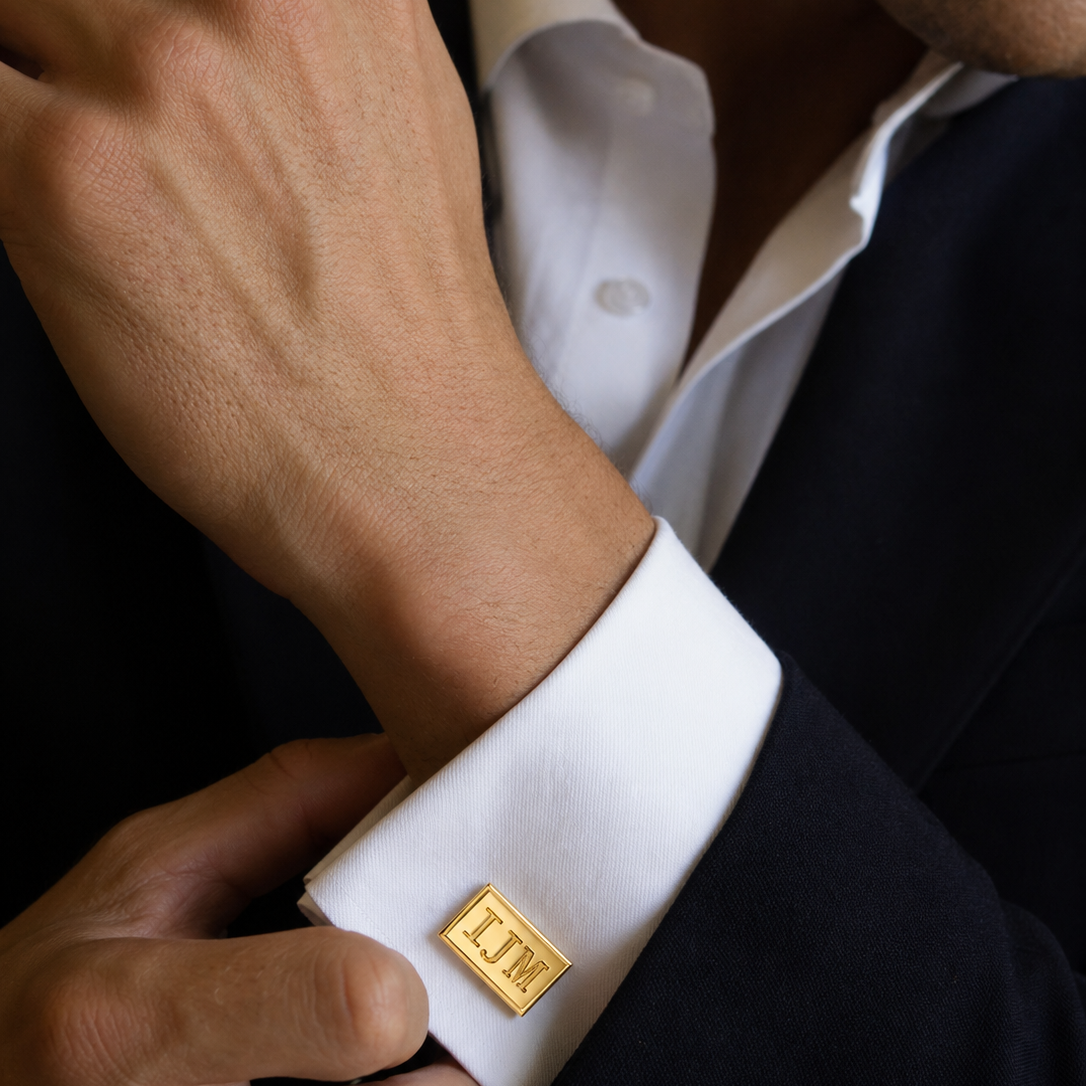Sterling silver rectangular cufflinks with engraving surface modeled on a male.