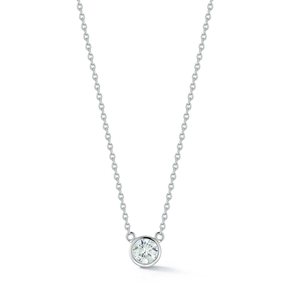 0.20ct round diamond bezel pendant necklace in 14k white gold by Laurenti New York.