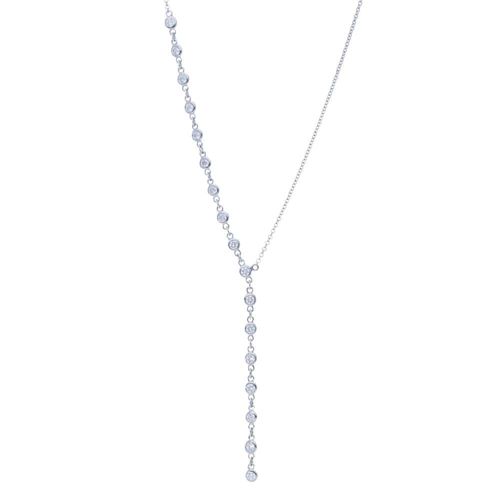 Y-drop necklace in 14k white gold featuring a cascading row of bezel-set round diamonds by Laurenti New York.