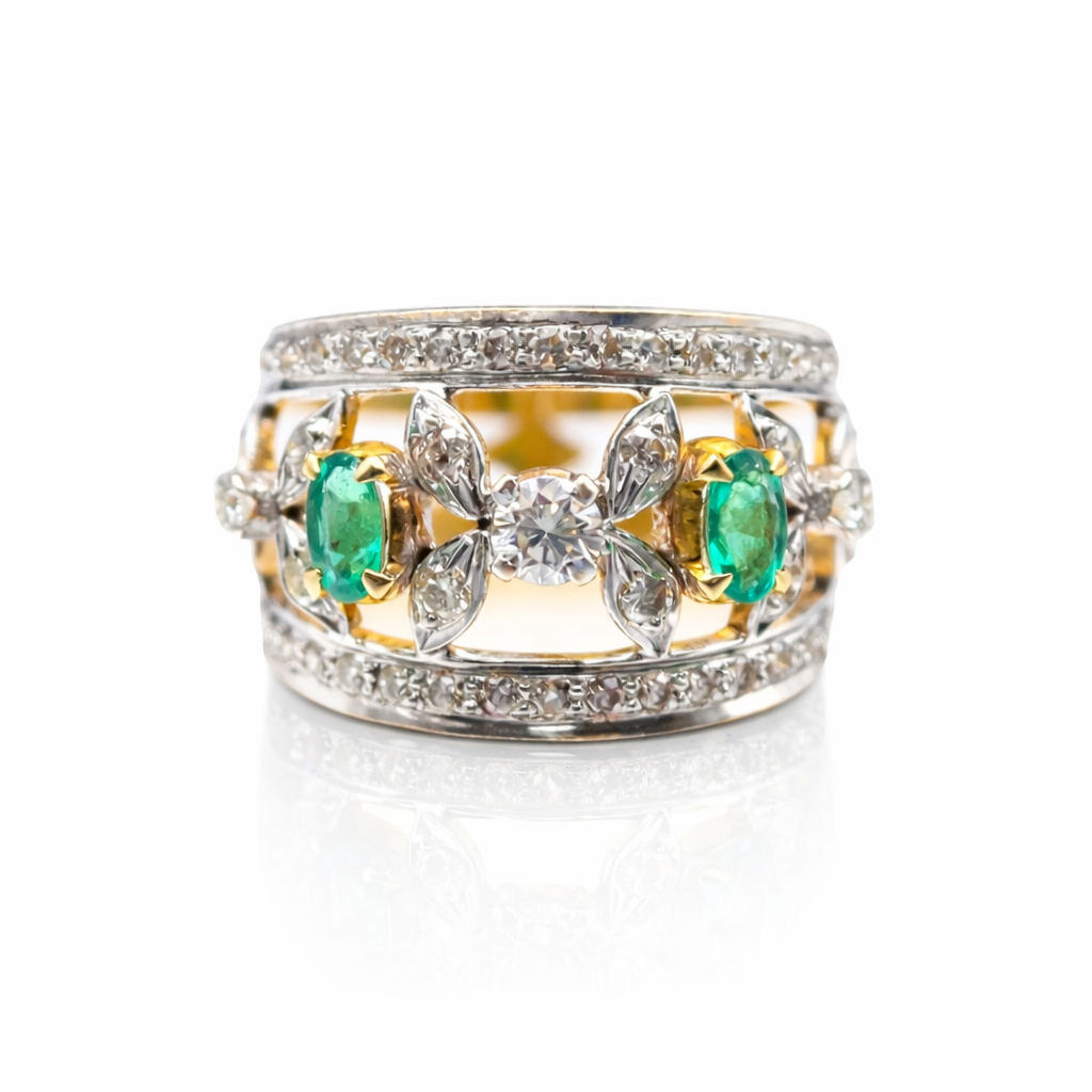marquise diamond and oval emerald ring in 18k white and yellow gold