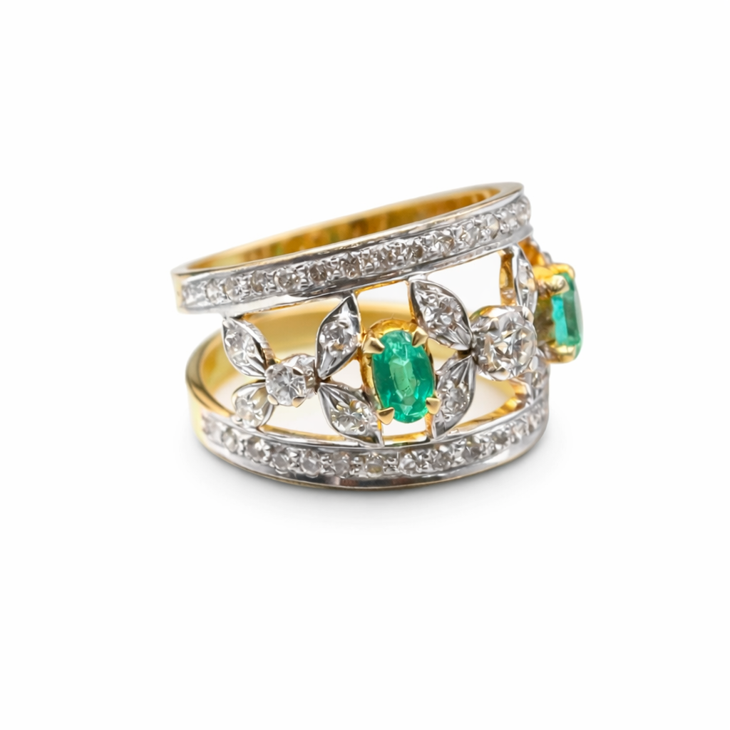 marquise diamond and oval emerald ring in 18k white and yellow gold