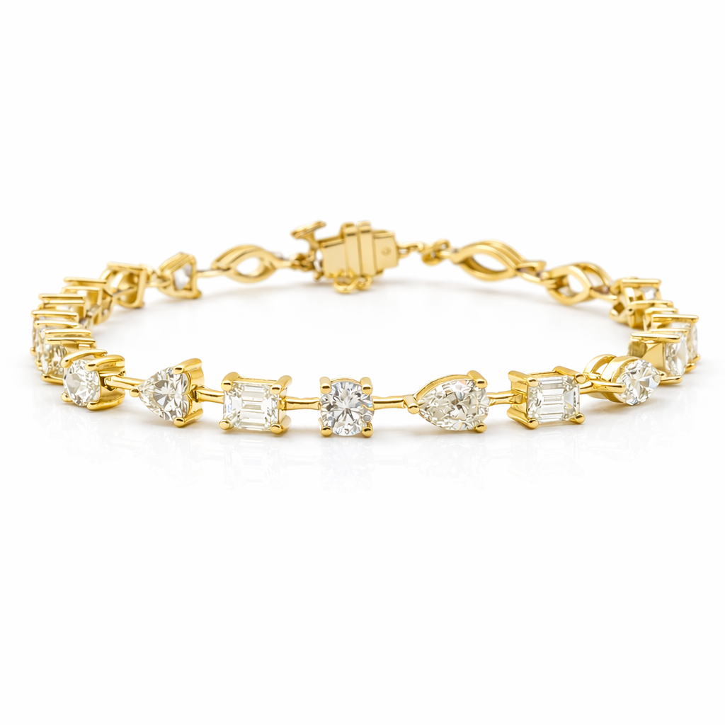 fancy shape diamond tennis bracelet with pear oval emerald cushion and marquise diamonds in 18k white gold