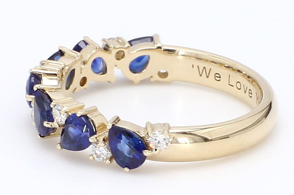 
                  
                    Laurenti 14K yellow gold celebration ring with pear-shaped sapphires and brilliant diamonds.
                  
                