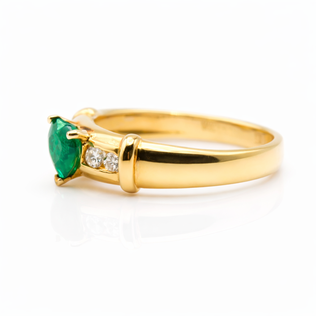 heart shaped emerald ring with diamond accents in 18k yellow gold