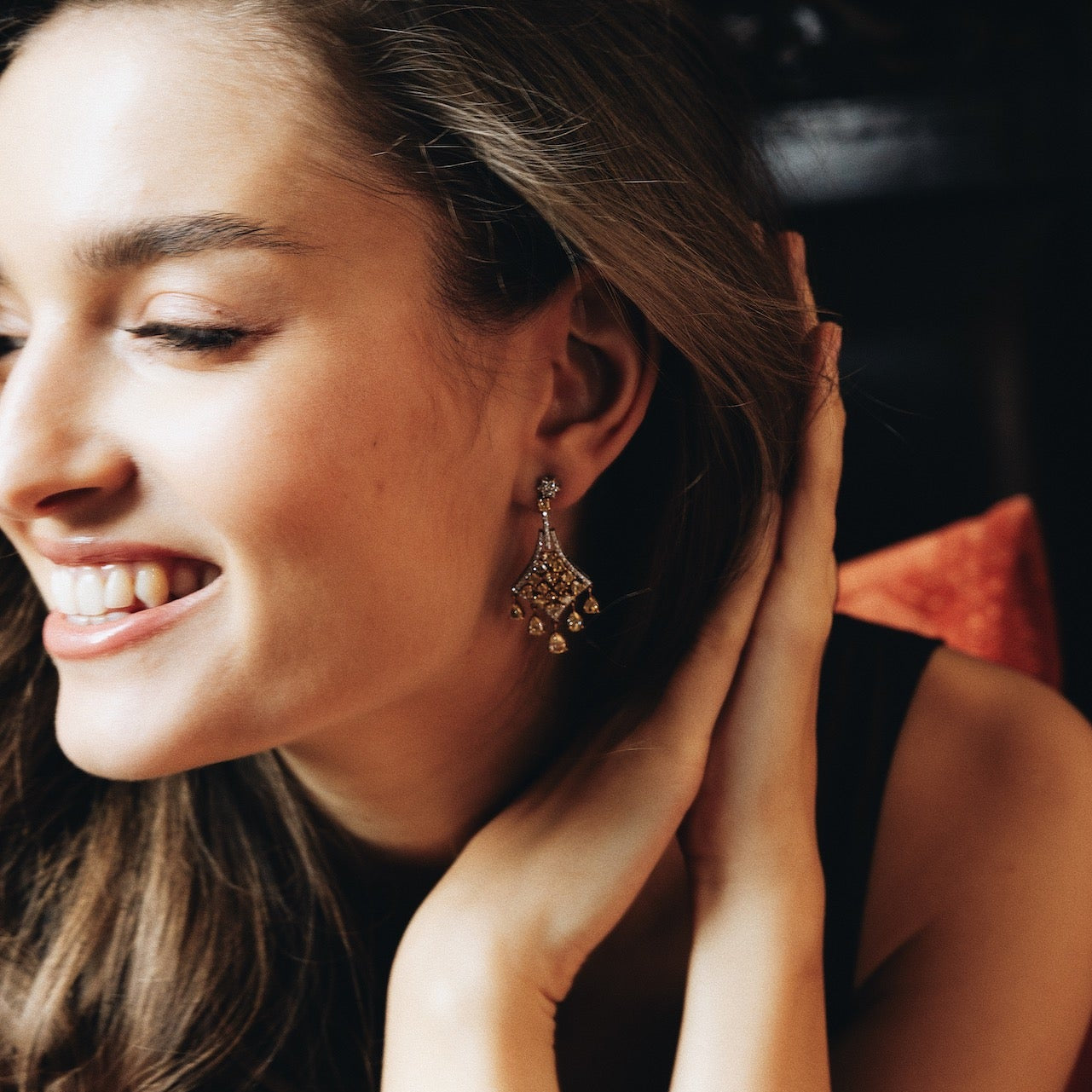Woman wearing earrings with a blurred background