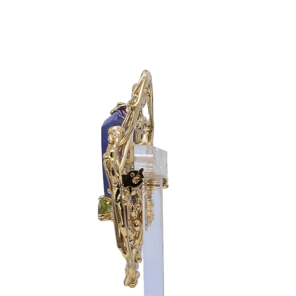 
                      
                        Bespoke Tanzanite Brooch in 18k Yellow Gold
                      
                    