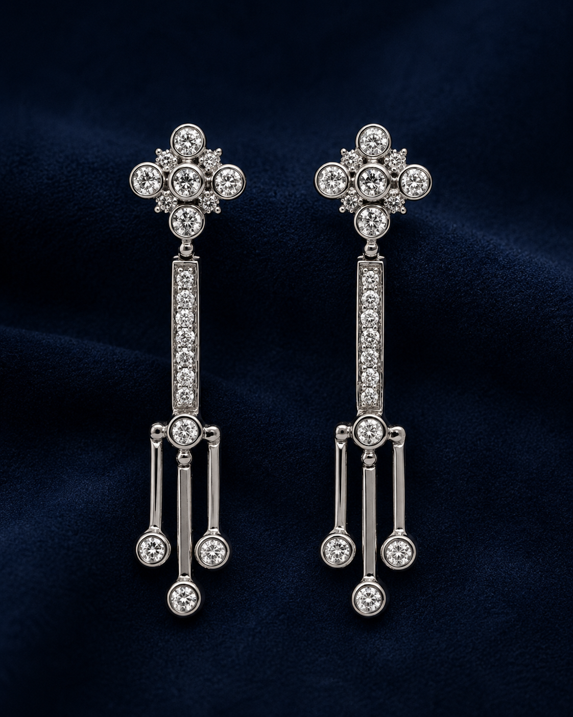 Diamond Drop Earrings on a Navy Background 