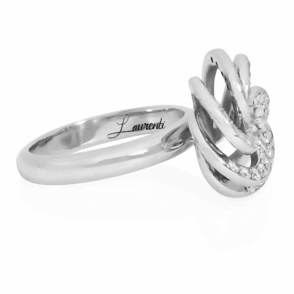 
                  
                    Angled close-up of Laurenti Camellia Diamond Cocktail Ring highlighting the Laurenti signature engraving and intricate diamond detailing.
                  
                