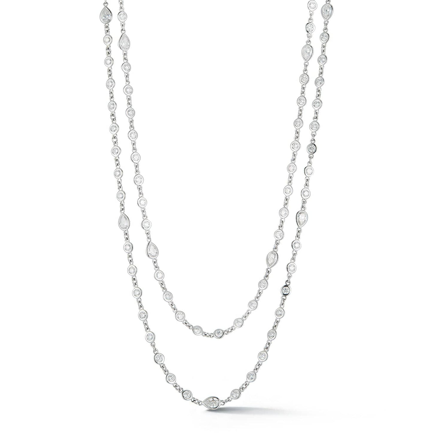 Long diamond station necklace featuring 240 round bezel-set diamonds totaling 8.36 carats in 14k white gold by Laurenti New York.