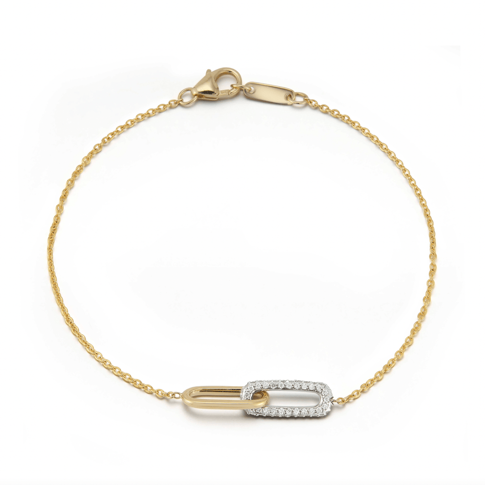 Delicate 14k gold bracelet by Laurenti featuring interlocking gold and pavé diamond links, total 0.24 carats.