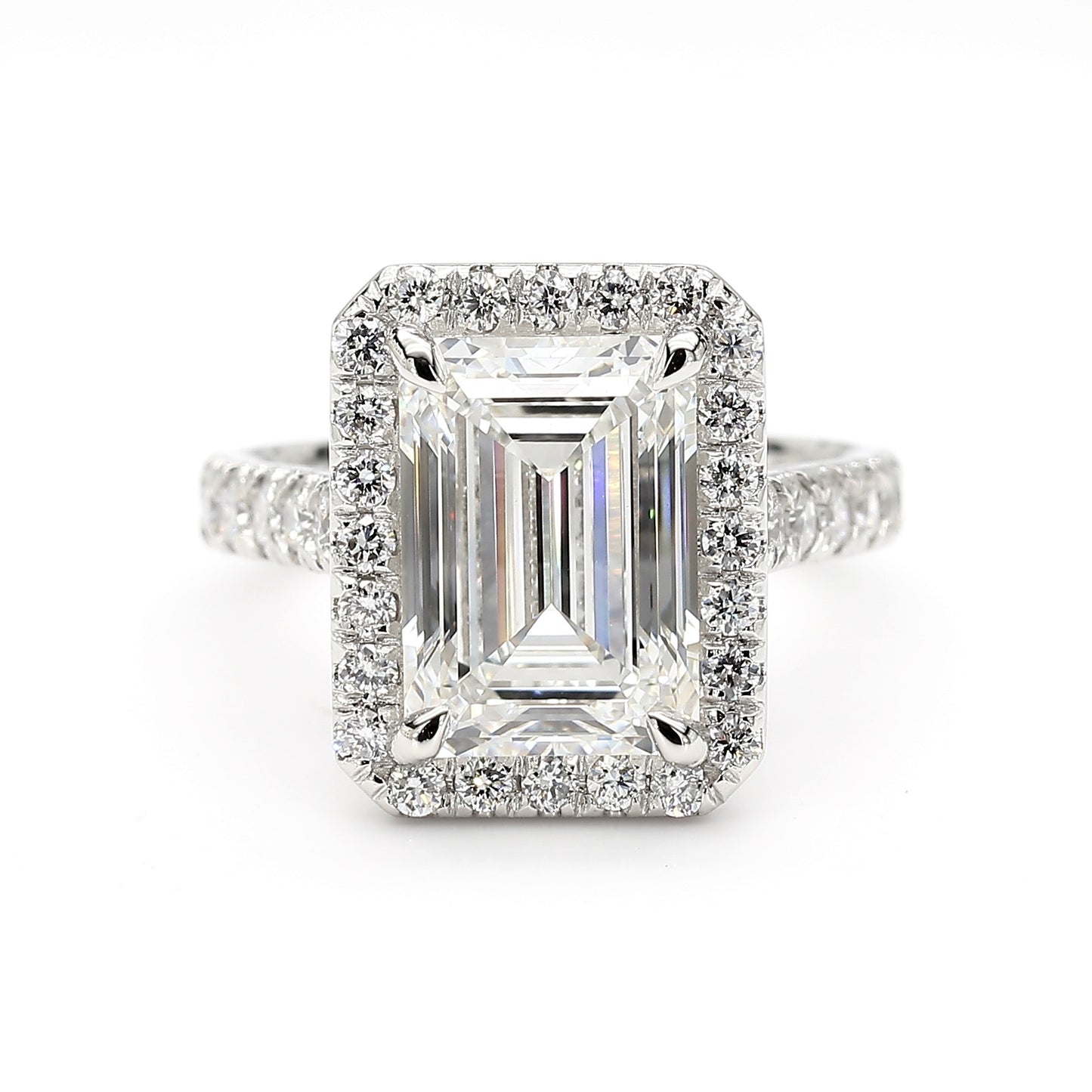 Front view of platinum emerald cut diamond engagement ring with halo