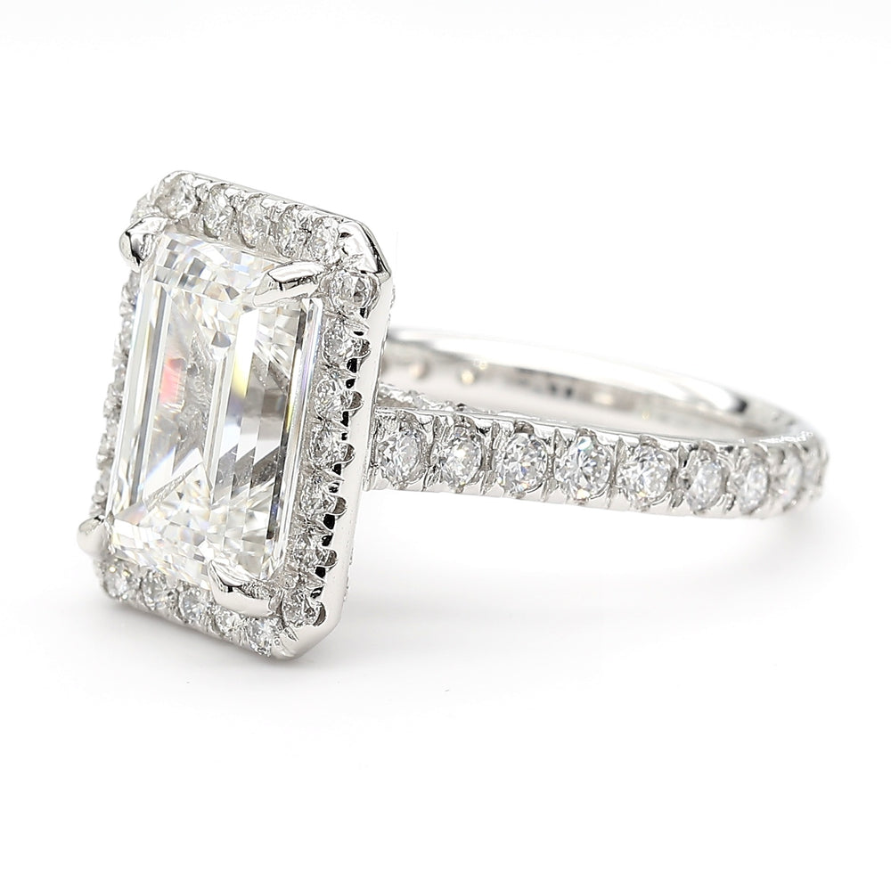 Side view showing pavé-set band and raised halo setting