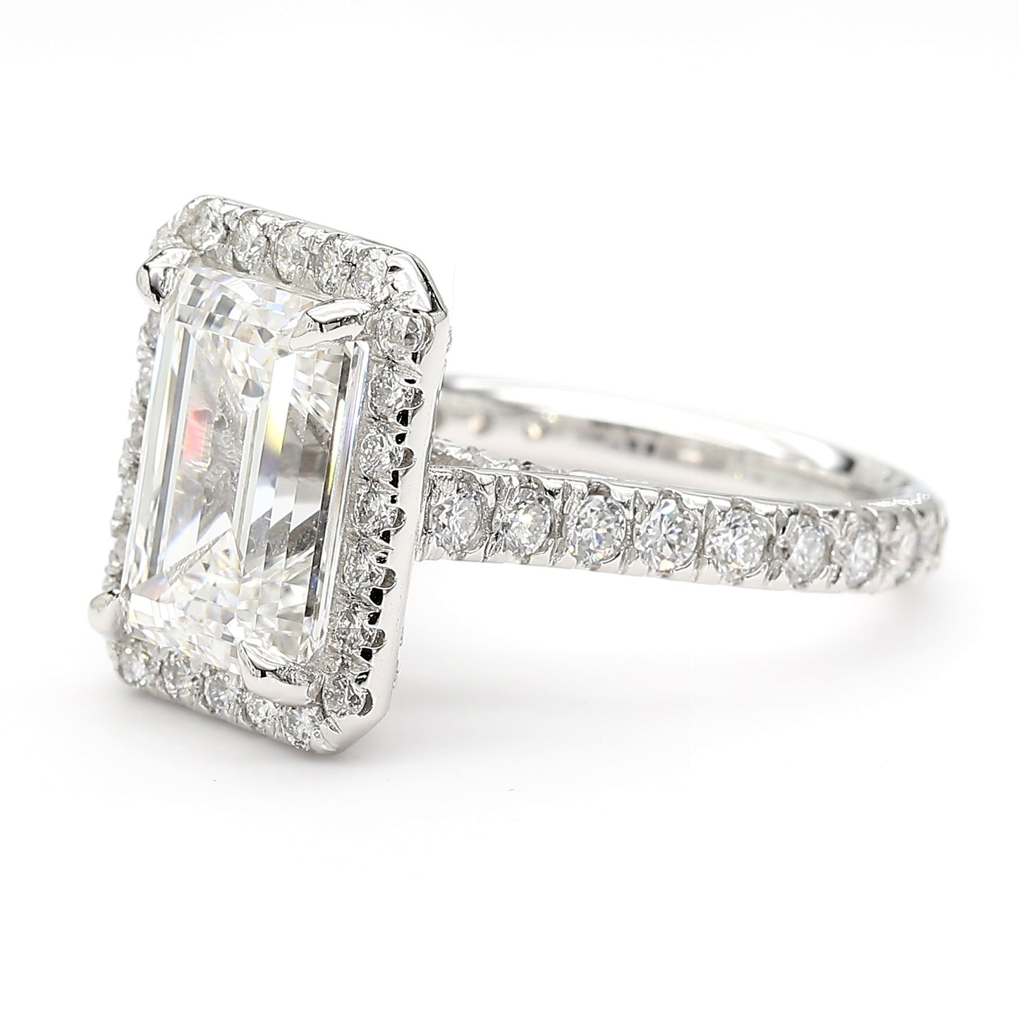 Side view showing pavé-set band and raised halo setting