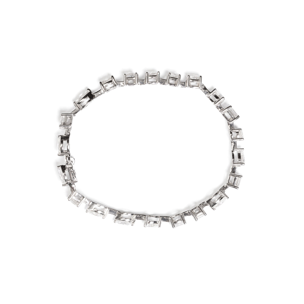 
                  
                    Laurenti 18k white gold cocktail bracelet with 8.00 carats of fancy cut diamonds – cushion, pear, oval, princess, emerald, and marquise top view
                  
                