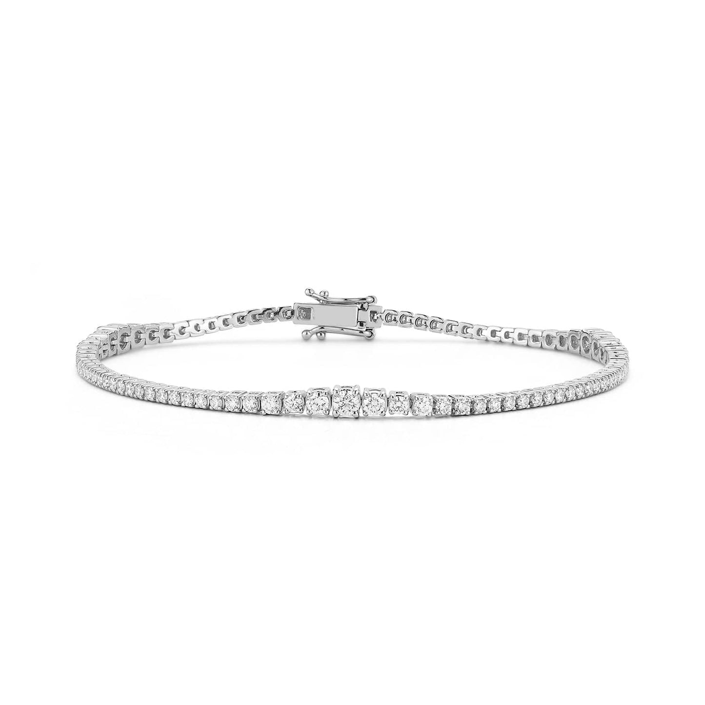 Laurenti 14k yellow gold diamond tennis bracelet with round brilliant-cut diamonds and secure clasp, displayed in a curved flat-lay.