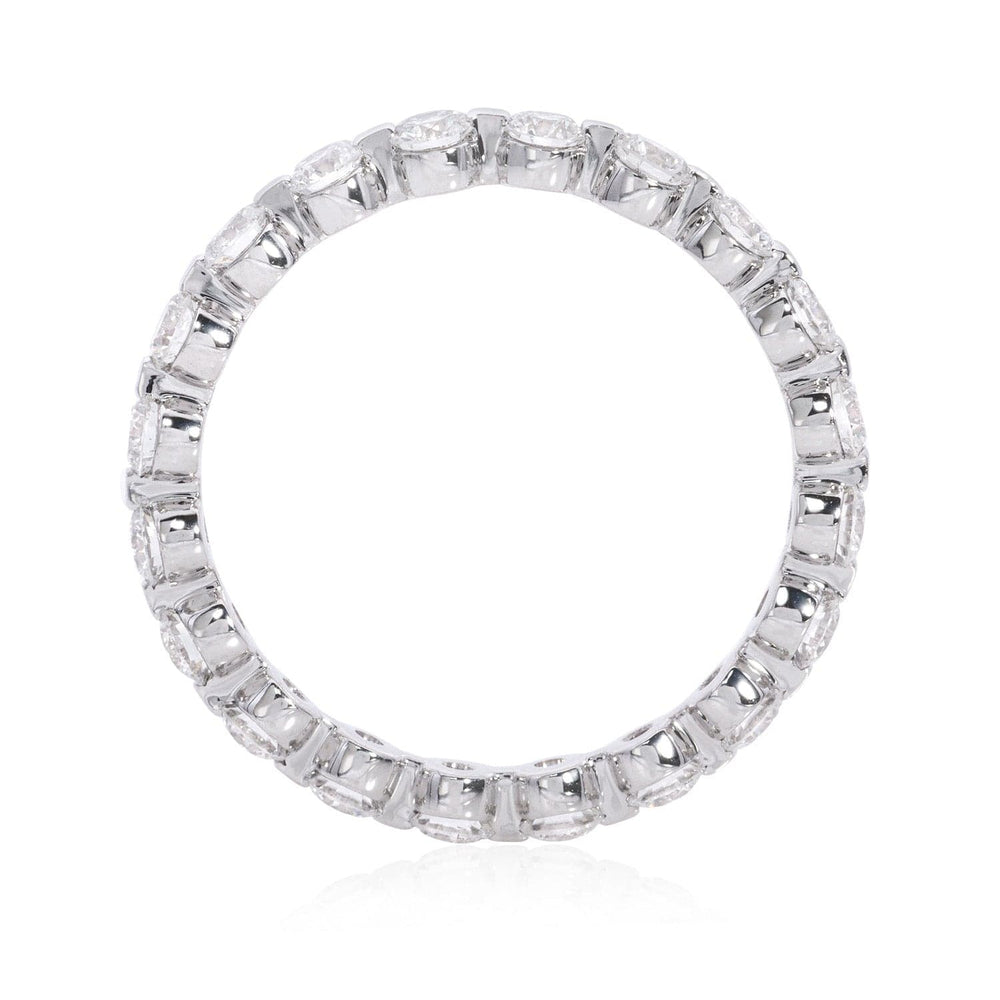 
                  
                    14K white gold eternity band with round brilliant diamonds in shared prong setting by Laurenti New York
                  
                