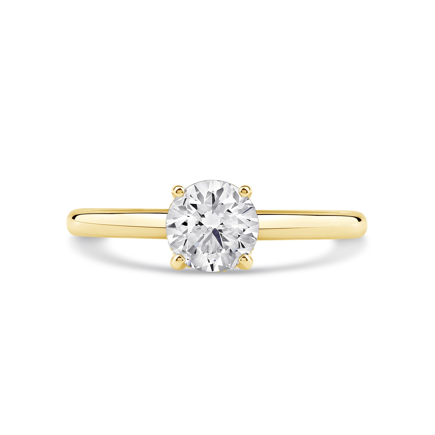 Gold ring with a clear gemstone on a white background
