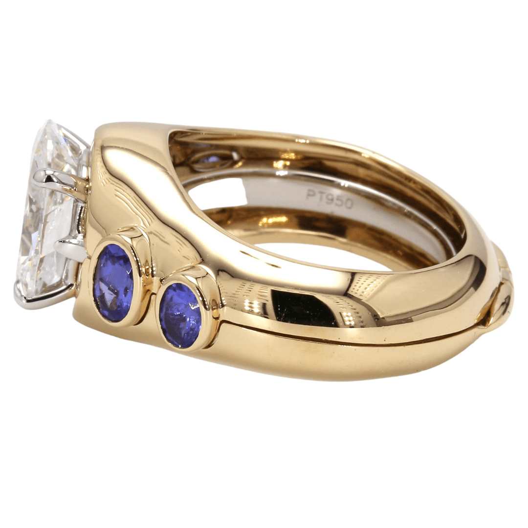 18K Yellow Gold Tanzanite Ring Jacket by Laurenti New York featuring bezel-set violet-blue tanzanite accents around a solitaire setting.