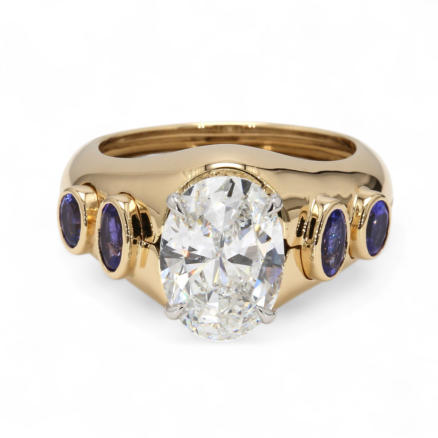 18K Yellow Gold Tanzanite Ring Jacket by Laurenti New York featuring bezel-set violet-blue tanzanite accents around a solitaire setting.