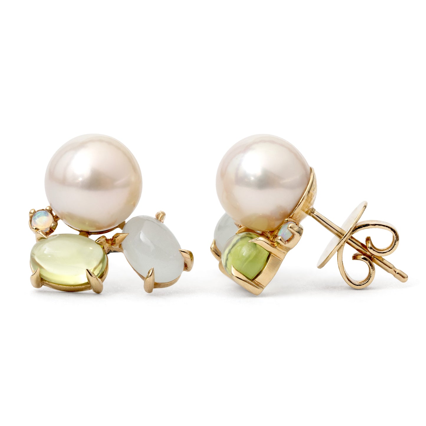 Pair of pearl and gemstone earrings on a white background