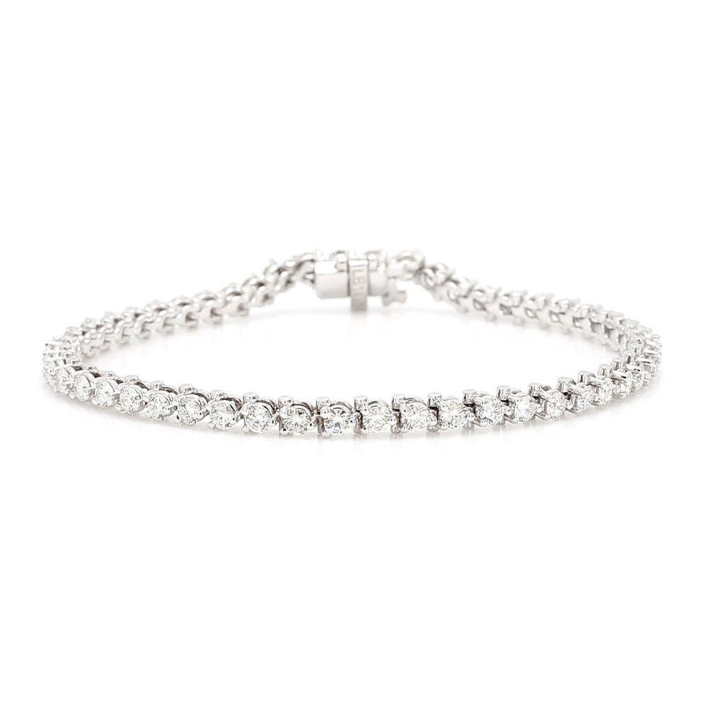 Laurenti New York three-prong diamond tennis bracelet in 14K white gold, featuring natural round brilliant-cut diamonds in a classic line setting. 