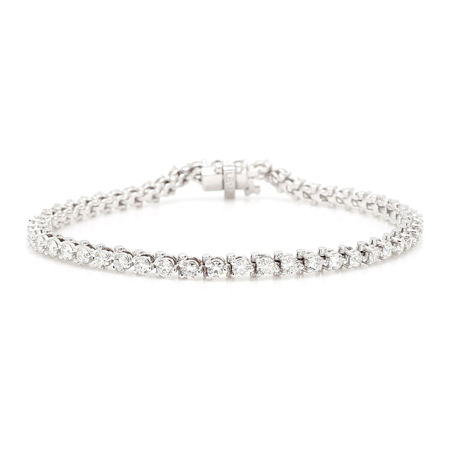 Laurenti New York three-prong diamond tennis bracelet in 14K white gold, featuring natural round brilliant-cut diamonds in a classic line setting. 